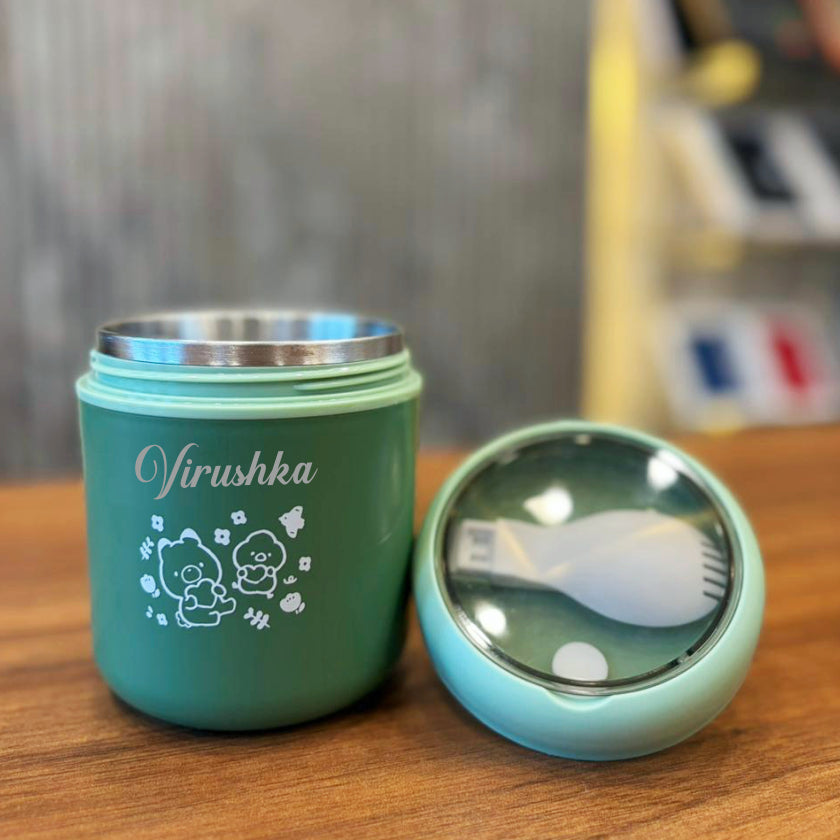 Green thermos with 'Virushka' branding on a wooden surface