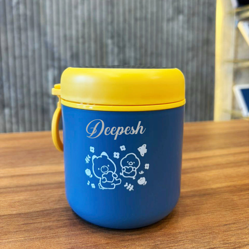 Blue container with yellow lid on a wooden surface