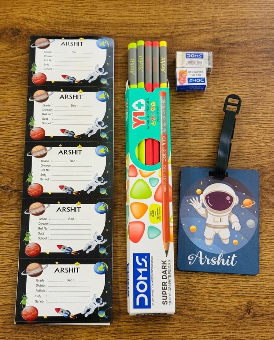 Pencils, eraser, and name tags on a wooden surface