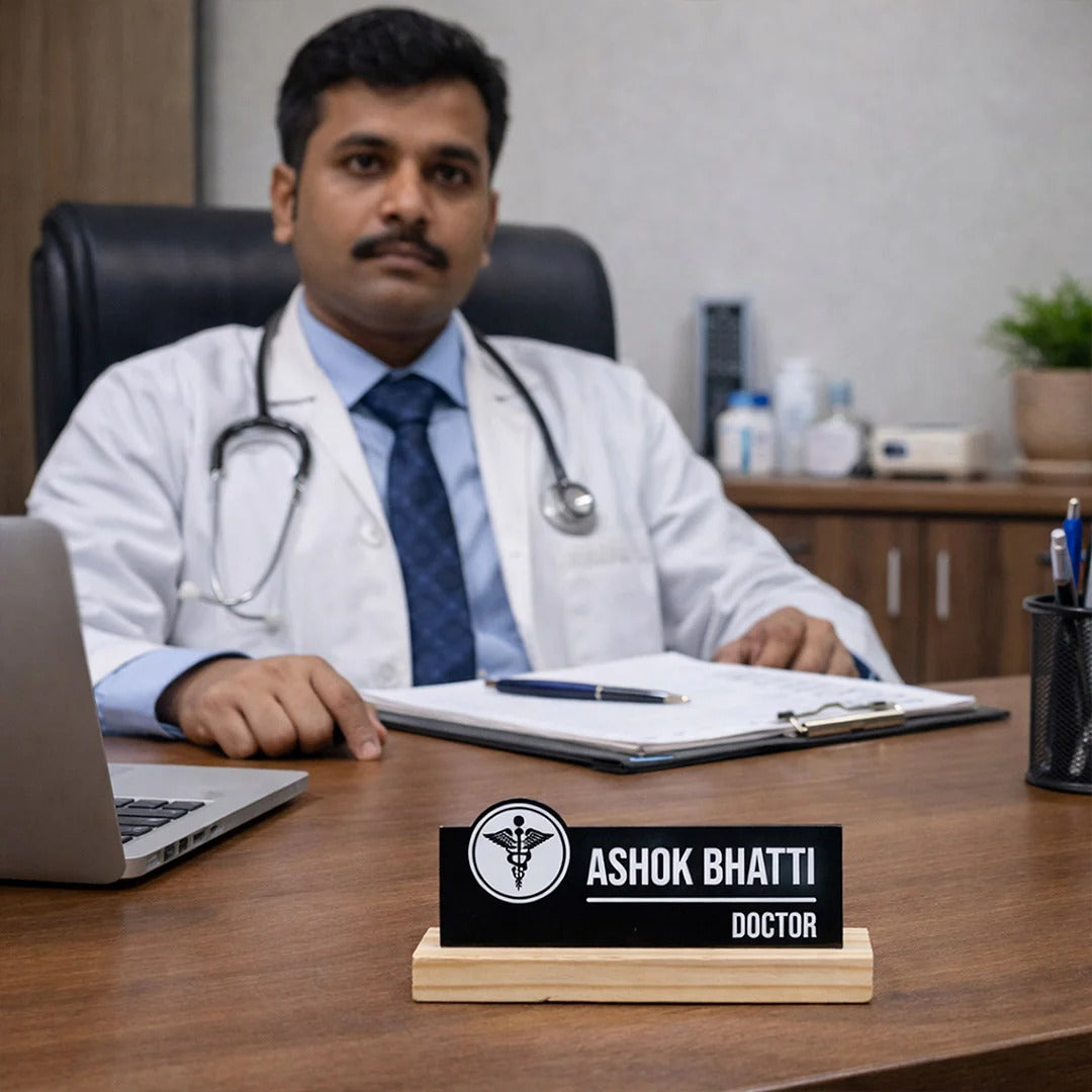 Doctor named Ashok Bhatti sitting at a desk with a laptop and notes, wearing a white coat and stethoscope.
