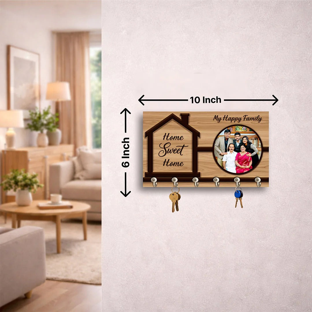 Wooden key holder with photo frame and text 'Home Sweet Home' in a living room setting.