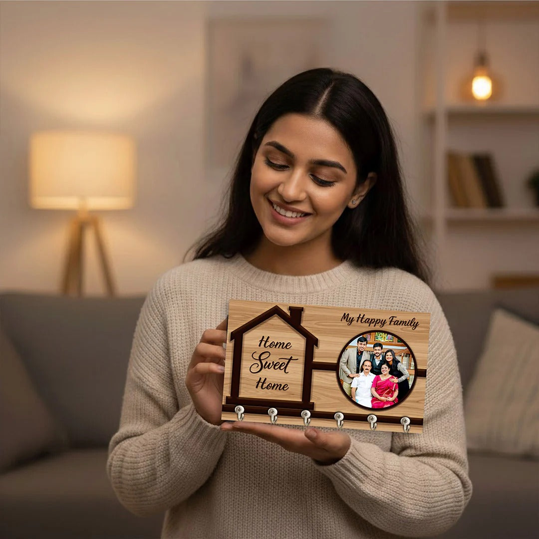 Woman holding a wooden plaque with family photo and text in a cozy living room.