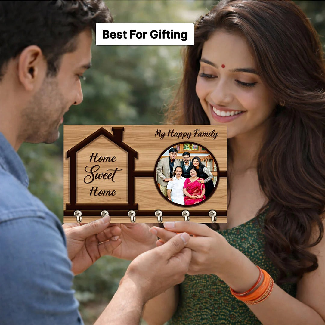 Couple holding a wooden plaque with 'Home Sweet Home' and family photo, best for gifting.