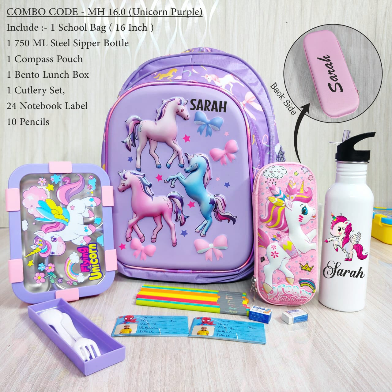 Children's school supply set with unicorn-themed backpack and stationery items on a wooden surface.