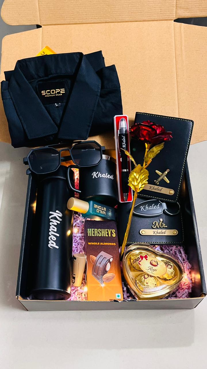 Gift box with a robe, sunglasses, and various items on a white background