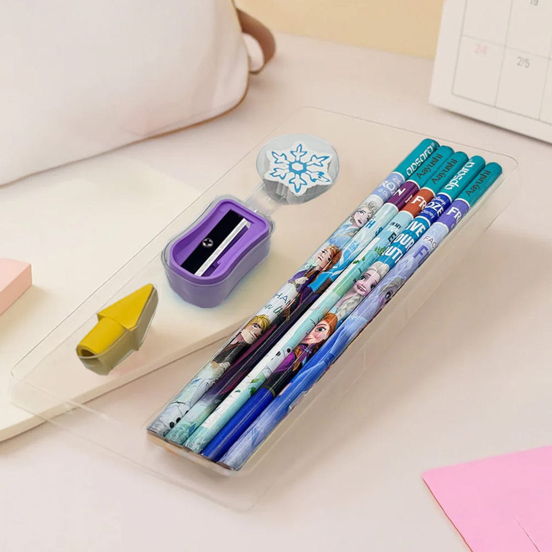 Set of pencils with Frozen design in a holder on a desk