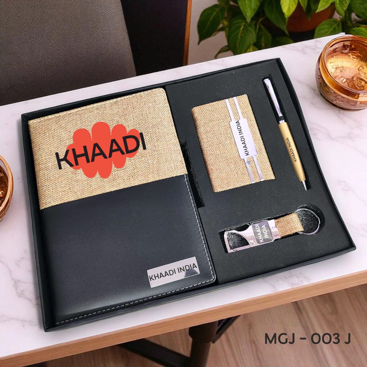 Khaadi India stationery set on a white surface with a plant in the background
