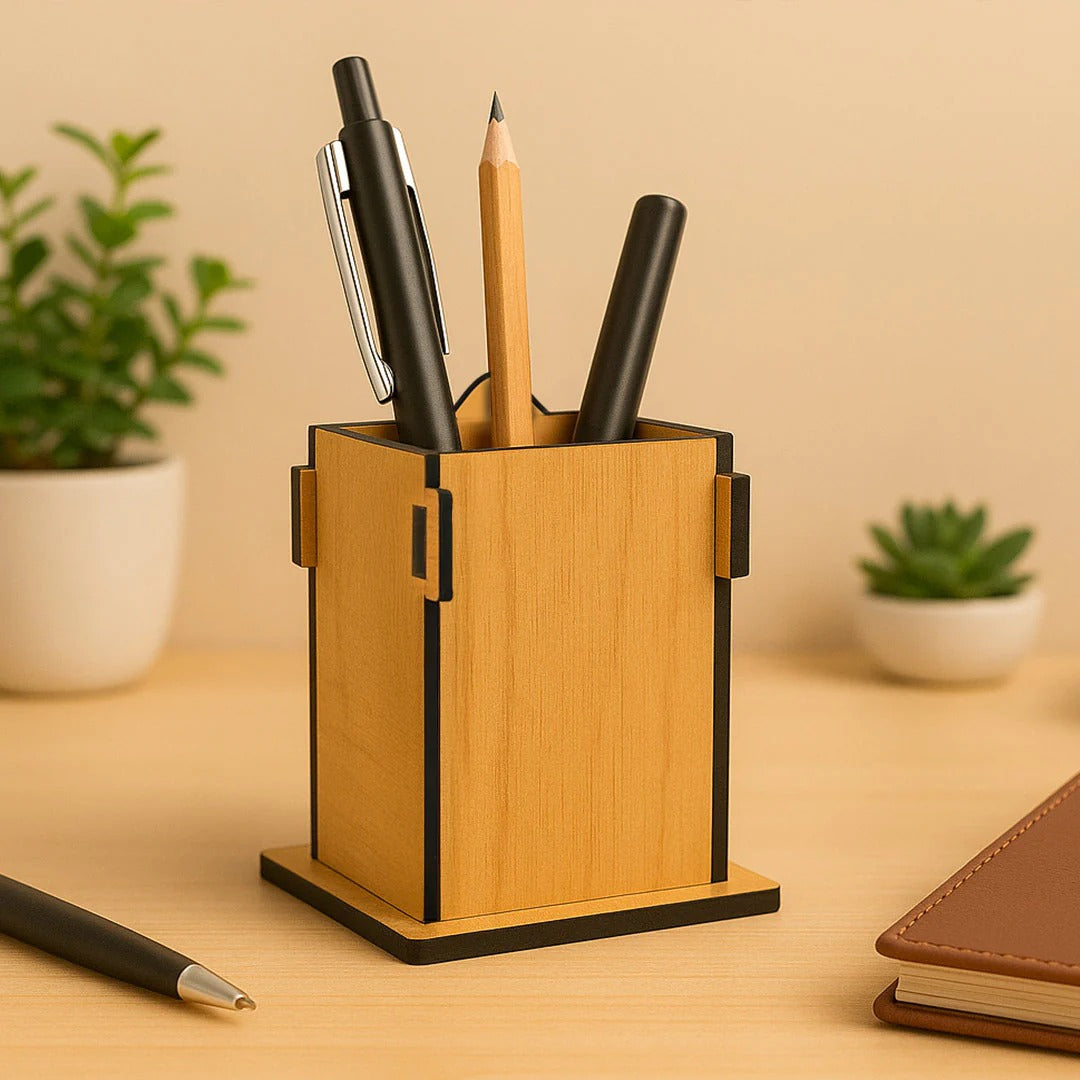 Wooden pen holder with pens on a desk with plants in the background