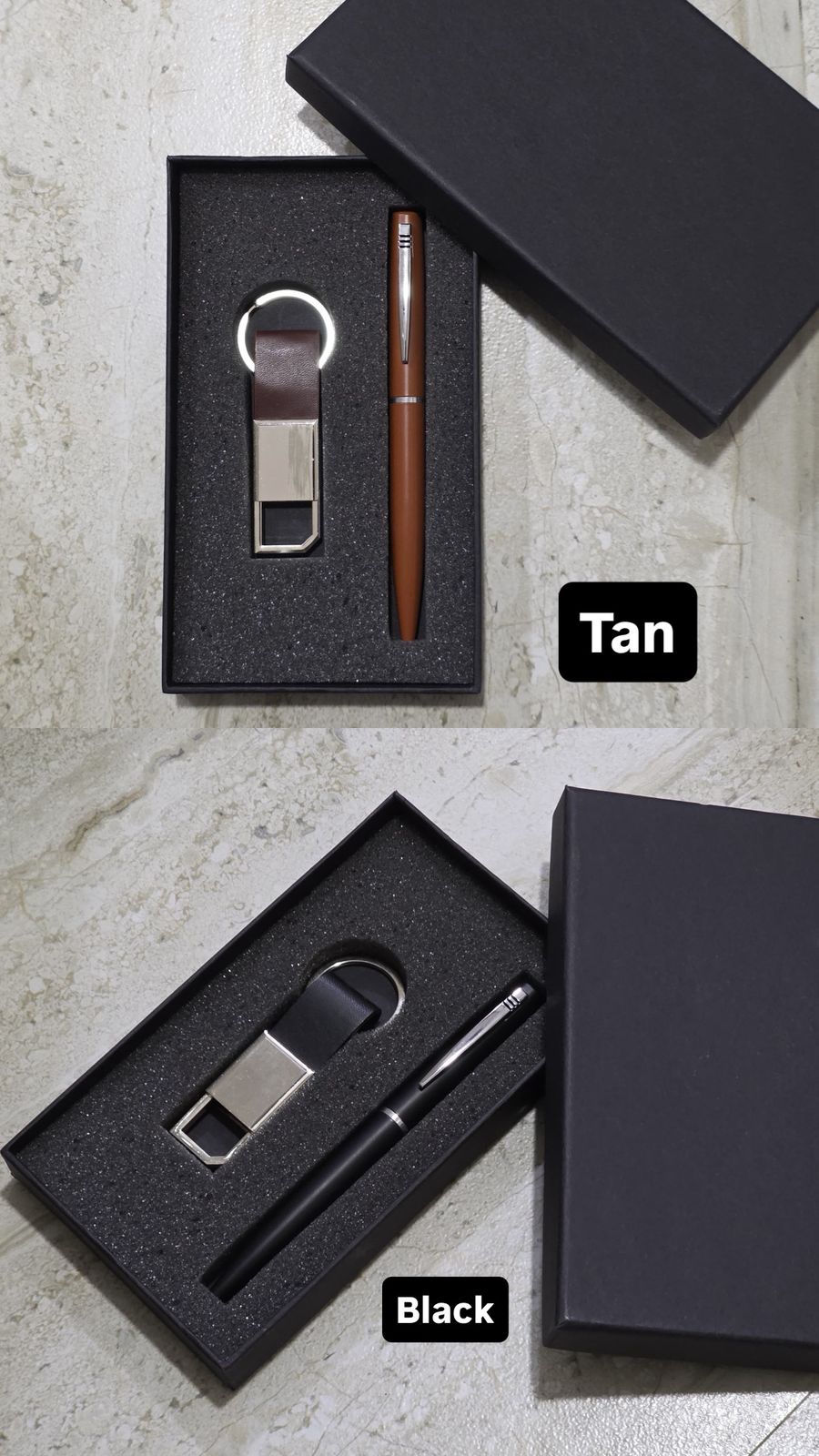 Set of keychain and pen with black and tan options on a concrete surface.