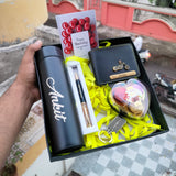 one bottle with custom name, and one black pen with custom name, and wallet and charm and name, love shape chocolate box, greeting card all are comes in one box.