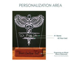 explaining about personalization area ,like where we cab give our name and logo and designationCustomizable LED night light featuring a detailed caduceus symbol, personalized with the personalized name   and the any customized designation displayed on a wooden base with the option to add custom text at the bottom