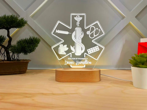 Personalized Doctor Pharmacy LED Lamp with customizable features. Ideal for doctors, this unique lamp provides a gentle yet powerful LED light, perfect for illuminating workspaces in clinics or offices. A thoughtful gift for healthcare professionals, combining functionality and personal touch.