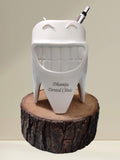 Dentist pen stand white thooth model ceramic penstand with customized name and hospital name, place on wooden round table one is placed in side the stand