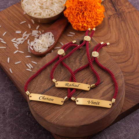 Elegant maroon engraved Rakhi