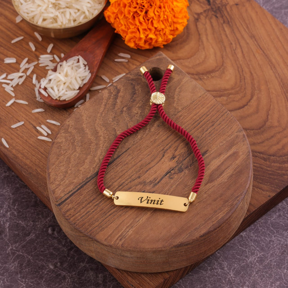 Elegant maroon engraved Rakhi