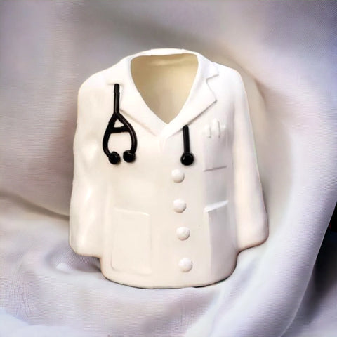 white ceramic apron pen stand with stethoscope