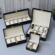 one girl is showing inside of the boxes very closly all are customized watch organizer boxes