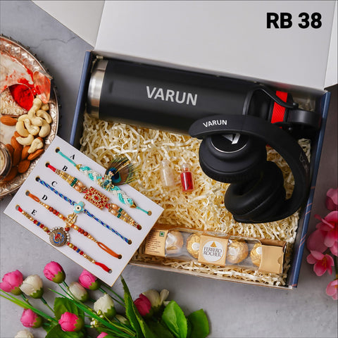 one blue color box is there and one head set with custom name and 5 models rakhi and one bottle with custom name one chocolate box and 2 small bottle glaas filled with chawal and roli