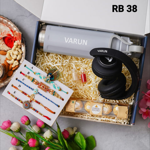 one blue color box is there and one head set with custom name and 5 models rakhi and one bottle with custom name one chocolate box and 2 small bottle glaas filled with chawal and roli