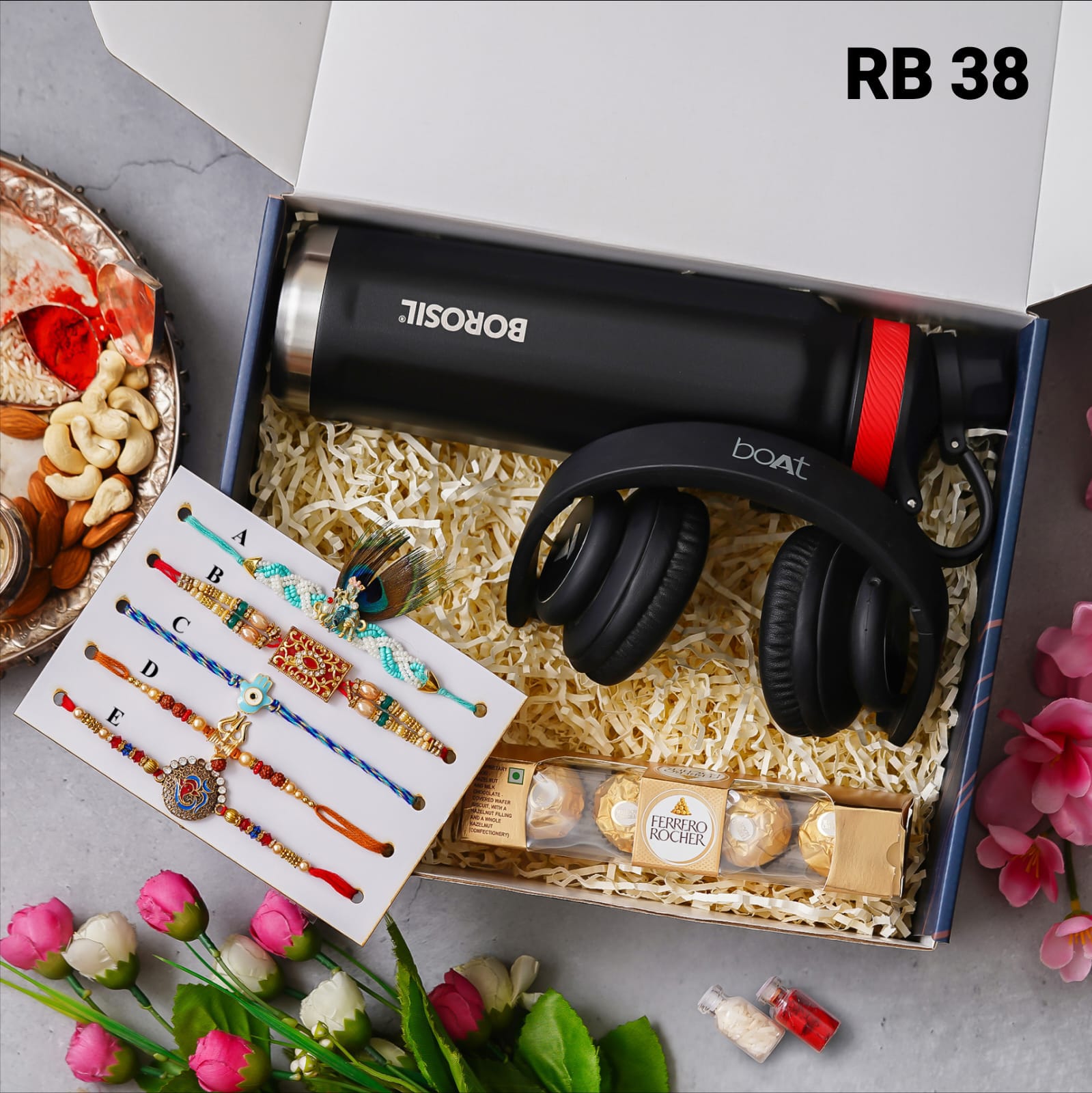 one blue color box is there and one head set with custom name and 5 models rakhi and one bottle with custom name one chocolate box and 2 small bottle glaas filled with chawal and roli