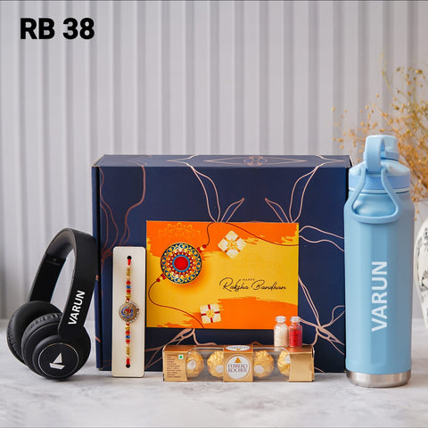 one blue color box is there and one head set with custom name and one rakhi and one bottle with custom name one chocolate box and 2 small bottle glaas filled with chawal and roli