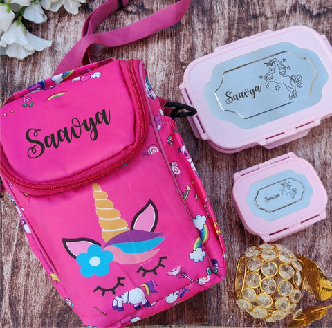 Pink unicorn-themed bag with 'Saavya' branding on a wooden surface.