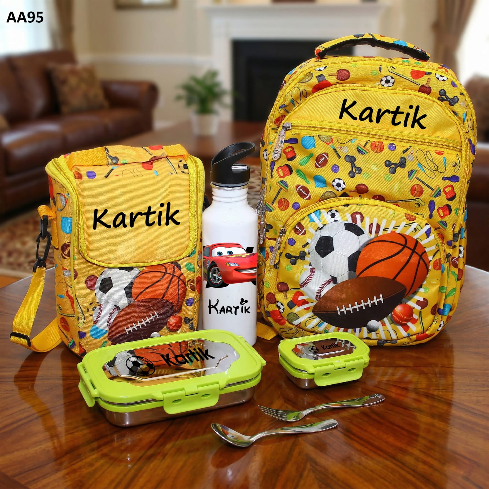 Yellow backpack with sports-themed design and personalized name 'Kartik' on a wooden table.