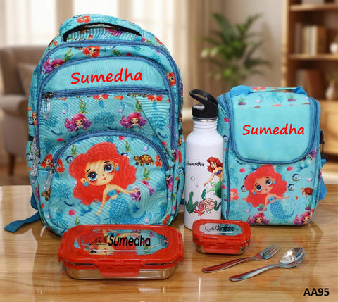 Children's backpack, water bottle, and lunch box with 'Sumedha' branding on a wooden surface.