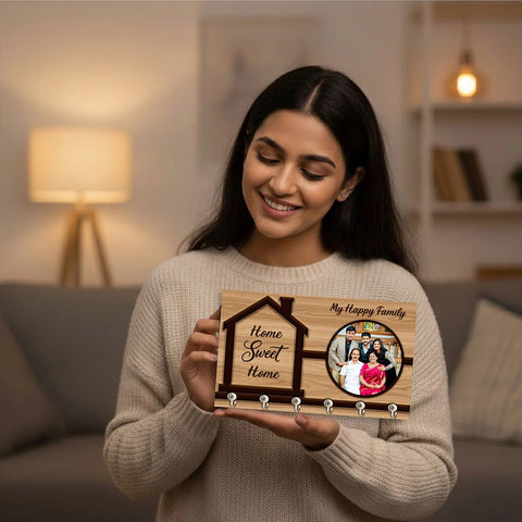Woman holding a wooden plaque with family photo and text in a cozy living room.