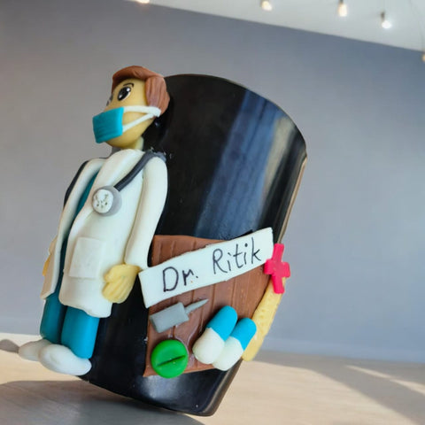 Customized ceramic mug featuring a handcrafted clay doctor figurine attached to the front and a personalized name engraving on the back. Ideal for healthcare professionals, this unique and thoughtful gift combines functionality with a personalized touch, perfect for enjoying beverages in style