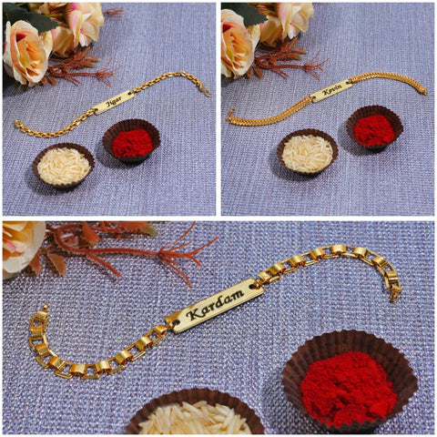 gold color bracelet rakhi with customizd name rakhi where in small 2 cups chaval and kunkum placed and beside some flowers are their