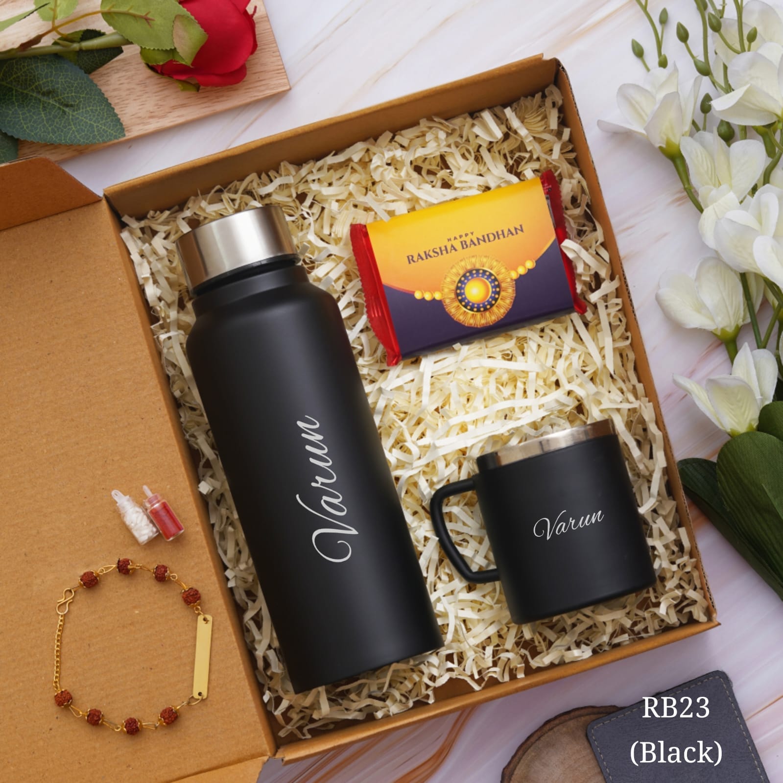 shown in picture there is one bottle and cup with name customization and rakhi also there with customization option , one chocolate is there, all are in one gift model box