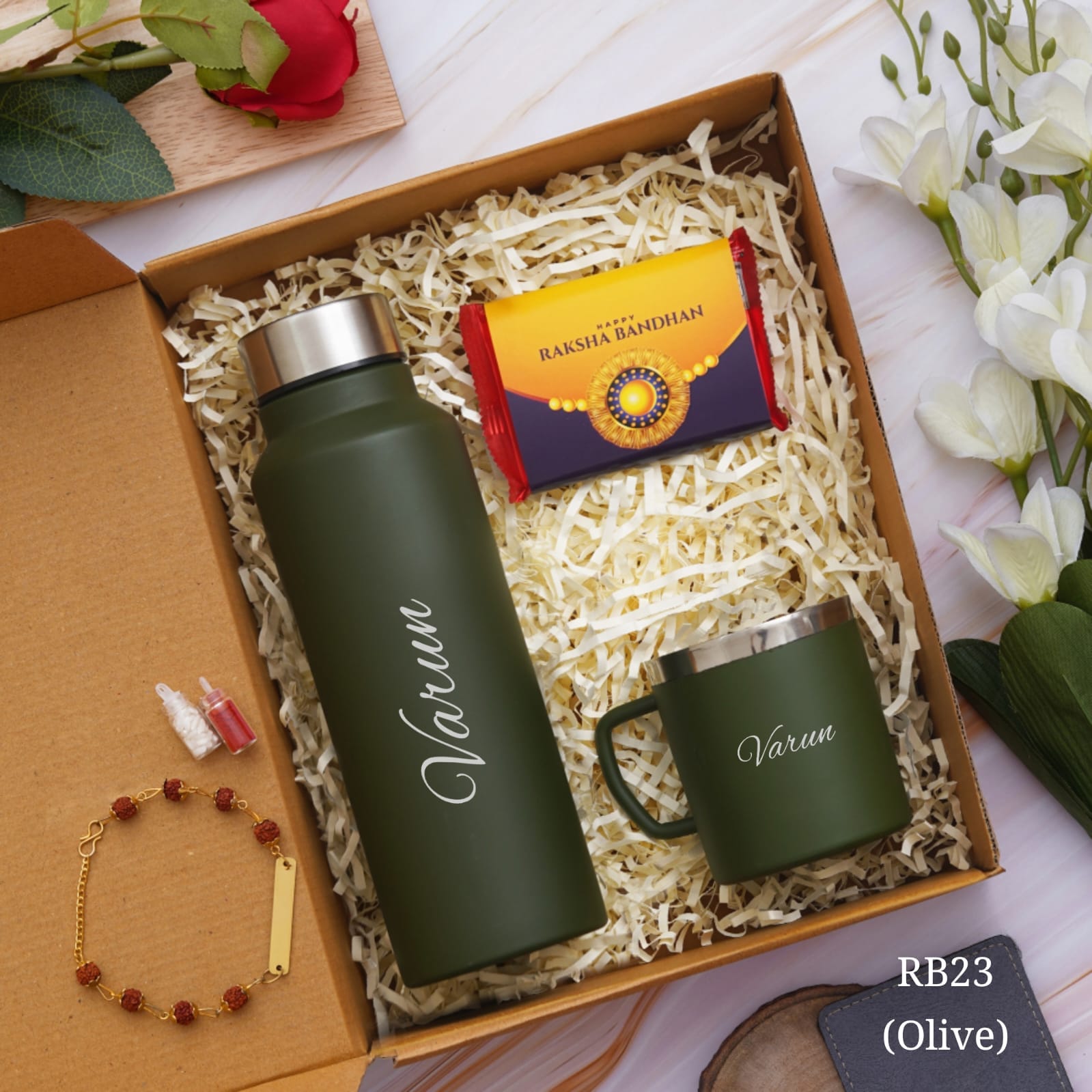 shown in picture there is one bottle and cup with name customization and rakhi also there with customization option , one chocolate is there, all are in one gift model box
