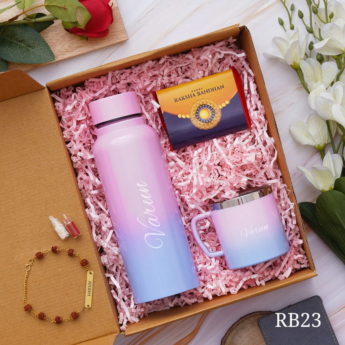 shown in picture there is one bottle and cup with name customization and rakhi also there with customization option , one chocolate is there, all are in one gift model box