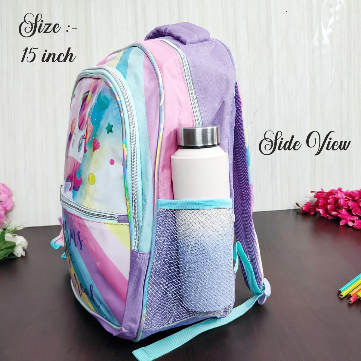 Colorful backpack with a water bottle on a wooden surface