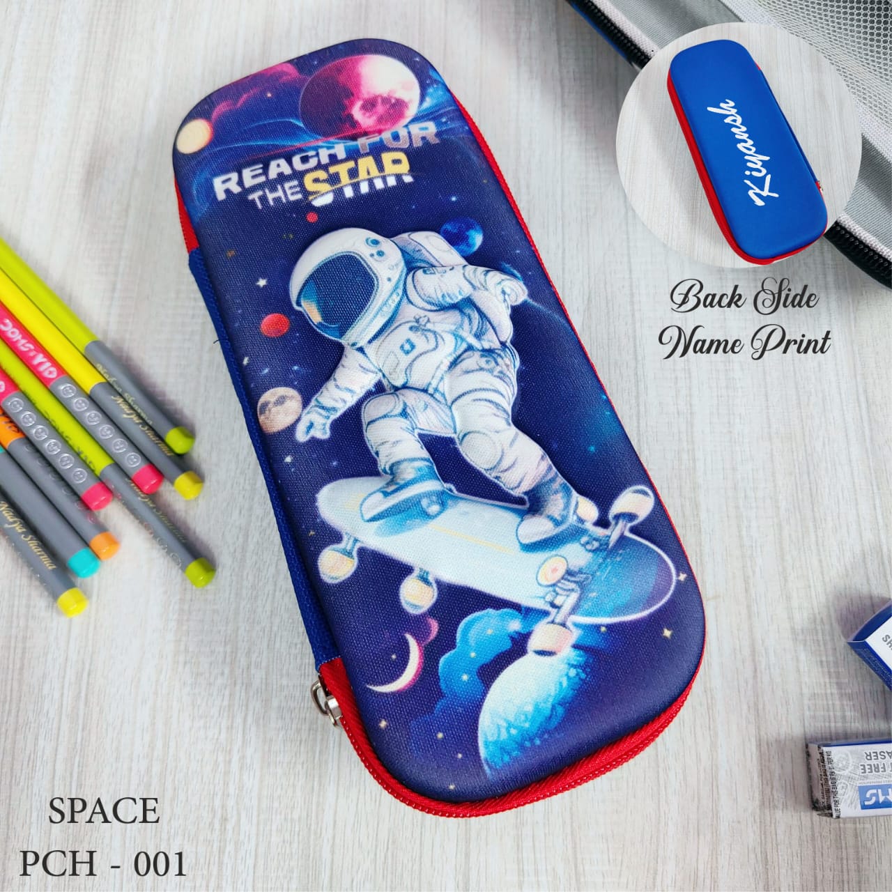 Pencil case with astronaut design on a wooden surface with stationery items.