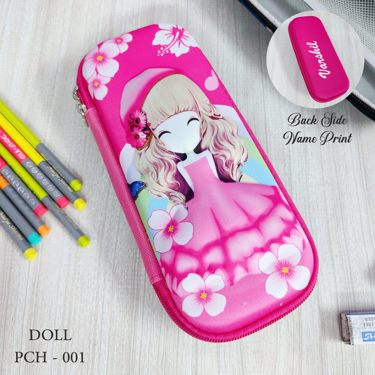 Pink pencil case with cartoon design on a light wooden surface with stationery items.