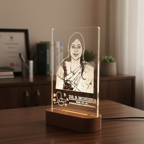 Acrylic lamp with engraved portrait and text on a wooden base