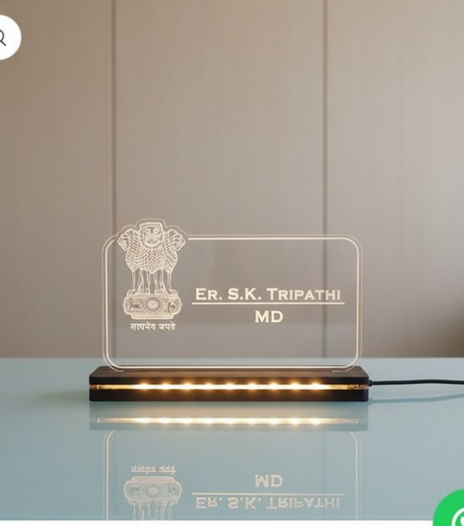 Acrylic plaque with engraved text and logo on a stand against a neutral background