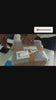 2 persons are opening the packed courier parcel while smiling, in black box it contains personalized mug with permanent name print and red heart shaped stethoscope,whatsup chat is there at end of the video,customer sent messages like best gift for doctors, really very happy ,some read heart and flower lovely emojies,wesite is bbdgifts.com