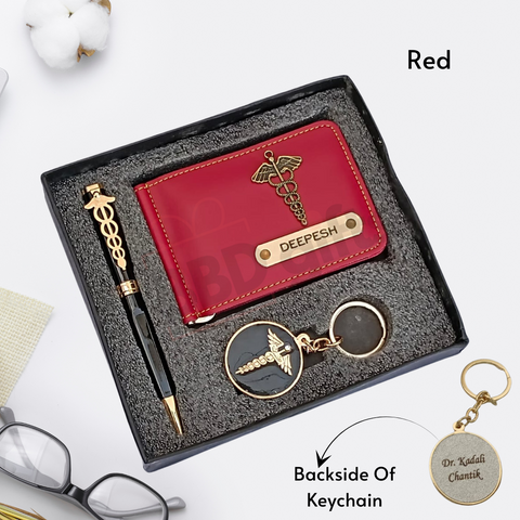 red colored wallet eith custom name and charm ,black color pen with custom name and custom logo with keychain where back side can be customize, all are placed in black gift box