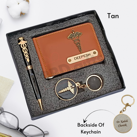 tan colored wallet eith custom name and charm ,black color pen with custom name and custom logo with keychain where back side can be customize, all are placed in black gift box