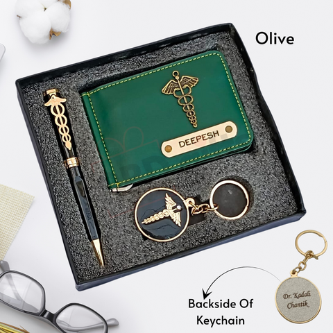 green colored wallet eith custom name and charm ,black color pen with custom name and custom logo with keychain where back side can be customize, all are placed in black gift box