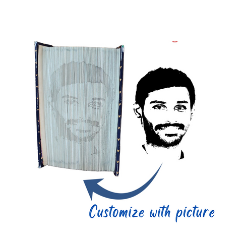 Handmade custom folded book art featuring a personalized portrait shadow design. Each piece is crafted by intricately folding book pages to create a unique, three-dimensional portrait. Ideal as a thoughtful and artistic gift for special occasions.