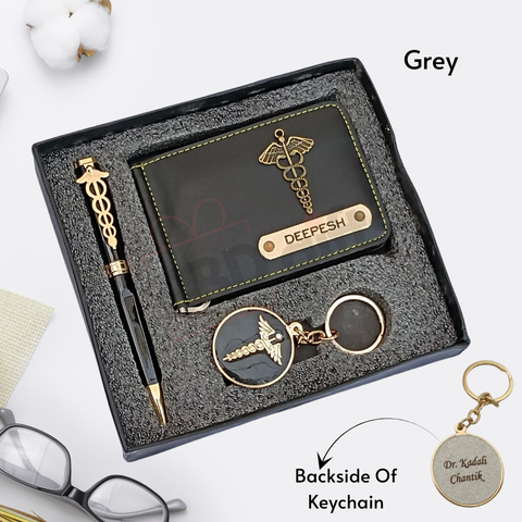 black colored wallet eith custom name and charm ,black color pen with custom name and custom logo with keychain where back side can be customize, all are placed in black gift box, grey color on background