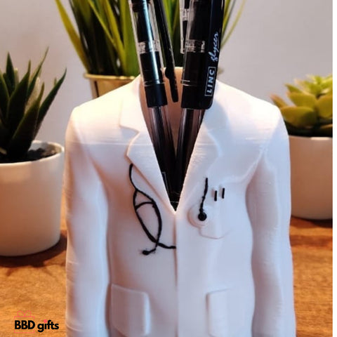 "Doctor-themed pen stand featuring a stethoscope, medical symbols, and a white coat design, ideal for organizing pens and pencils."