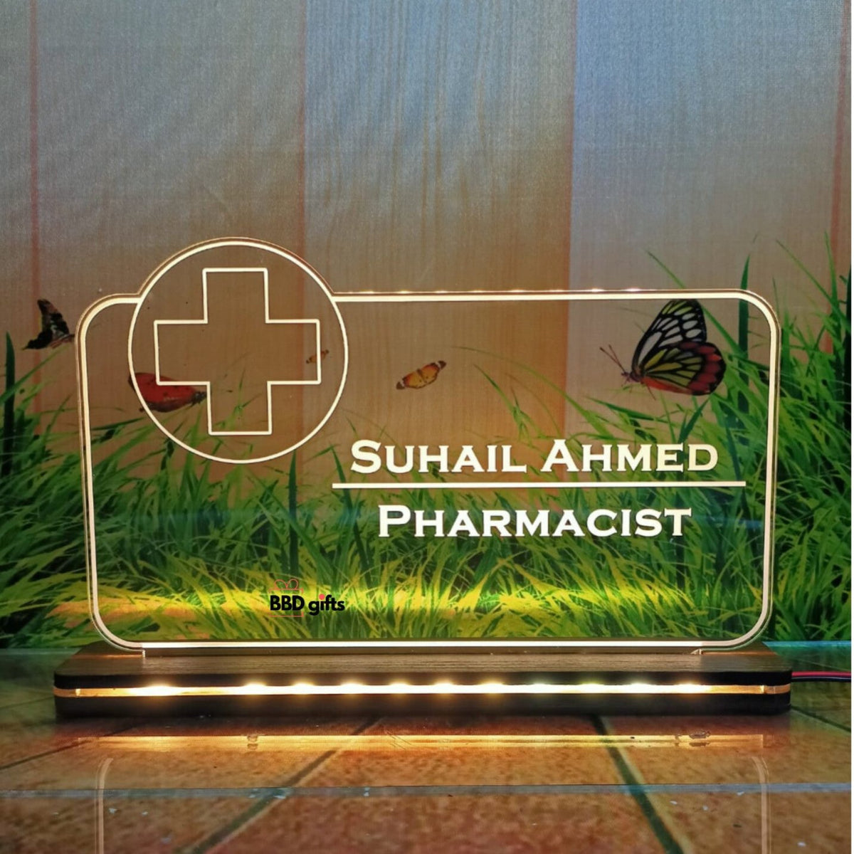 Gift for pharmacist ,table top with led with customized name and designation on it .